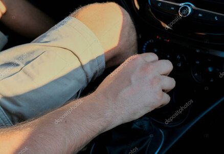 Close-up of a manual gear stick during a driving lesson